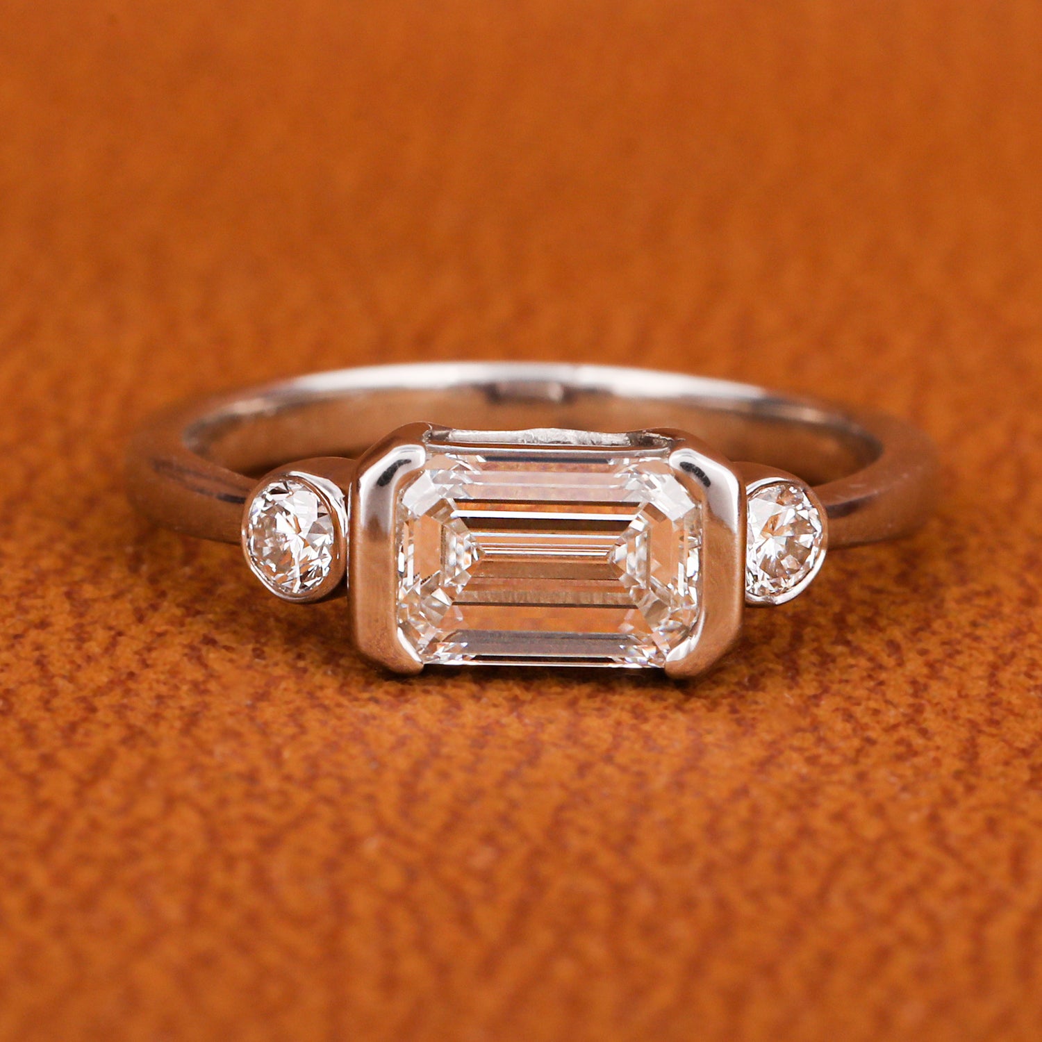 East West Emerald Cut Lab Grown Diamond Three Stone Engagement Ring